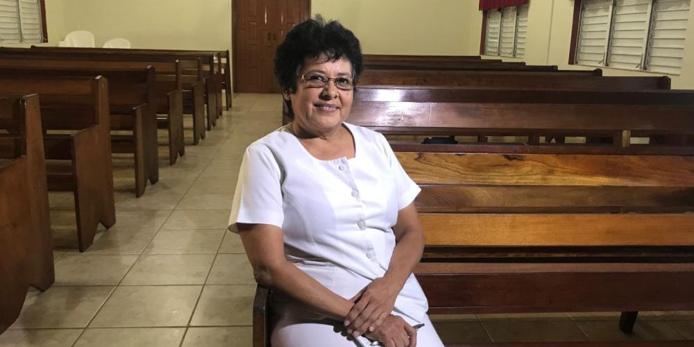 Leticia August, 60, sitting in a Seventh-day Adventist church in Belize's capital, Belmopan. (Andrew McChesney / Adventist Mission)