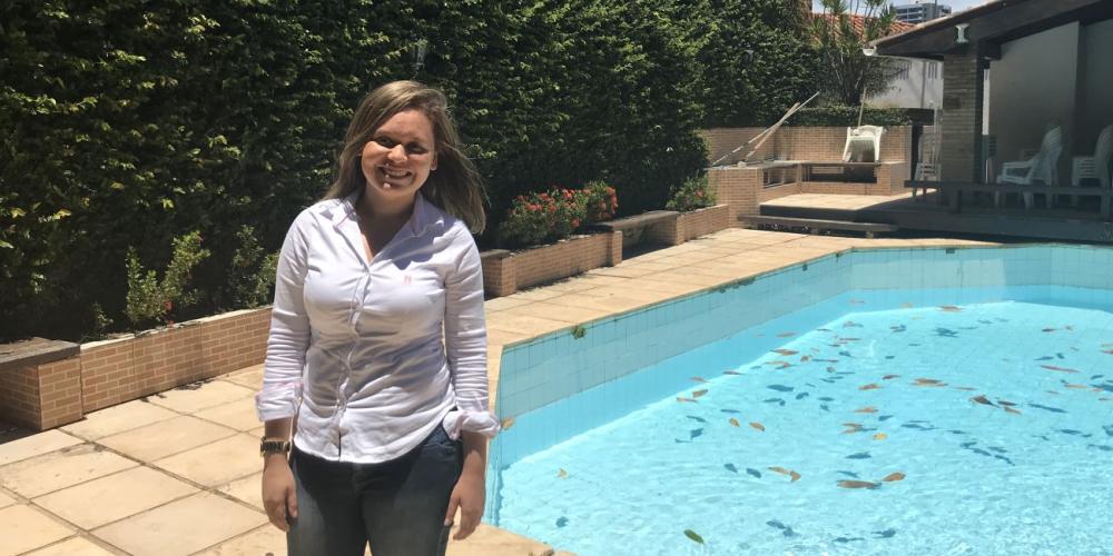 Beatriz de Jesus Santana, 23, standing near the pool where she was baptized in the yard of the Sharing Jesus house-church in Salvador, Brazil. (Andrew McChesney / Adventist Mission)
