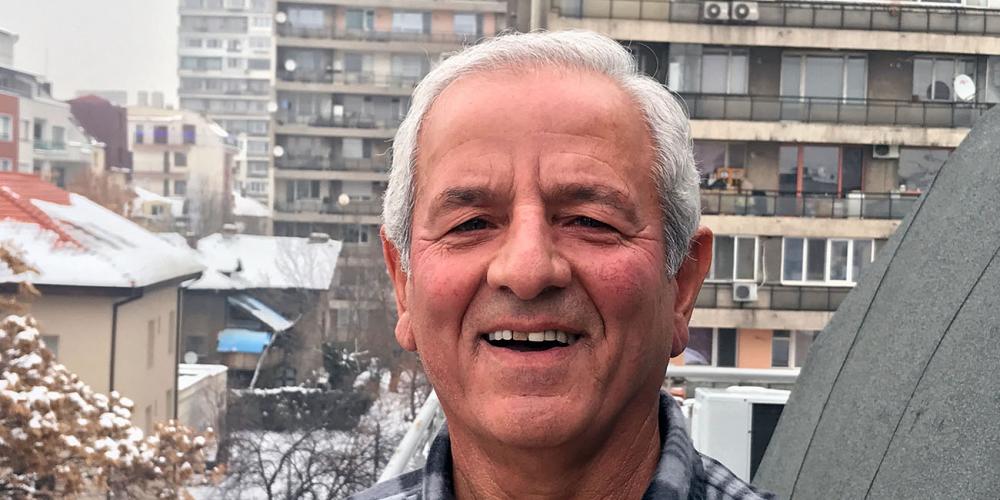 Borislav Mitov, 69, says the banging wheel reminds him of James 4:7, which says, “Therefore submit to God. Resist the devil and he will flee from you.” (Andrew McChesney / Adventist Mission)