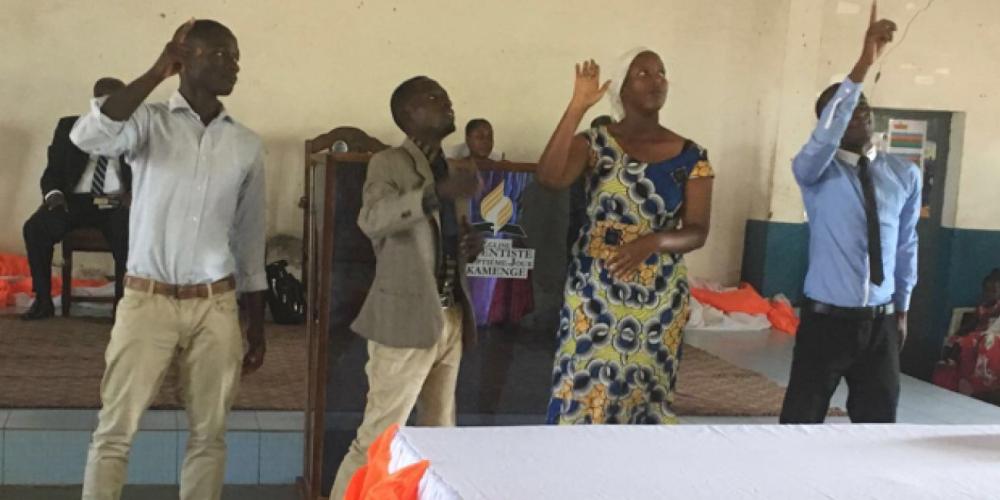 Deaf people praising God after being baptized at Kamenge Seventh-day Adventist Church in Burundi’s capital, Bujumbura, on March 25, 2017. (ECD)