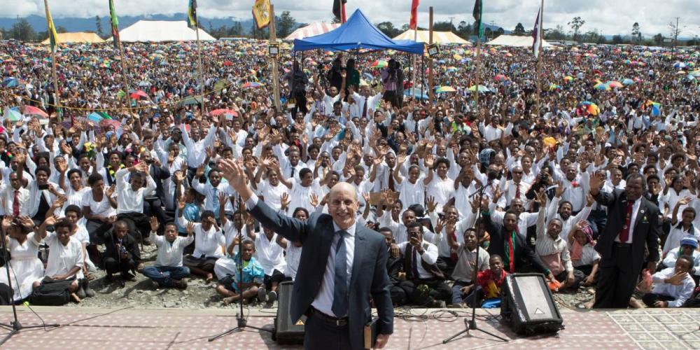 Doug Batchelor posing with baptismal candidates, in white, and others in Mount Hagen, Papua New Guinea, on Sabbath, April 1. (Photos courtesy of Doug Batchelor)