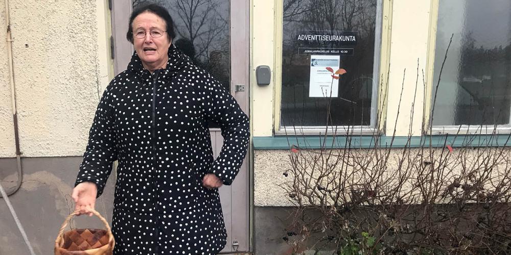 Soup kitchen director Riitta-Liisa Peltonen, 73, standing outside Piikkiö Seventh-day Adventist Church in southwestern Finland. (Andrew McChesney / Adventist Mission)