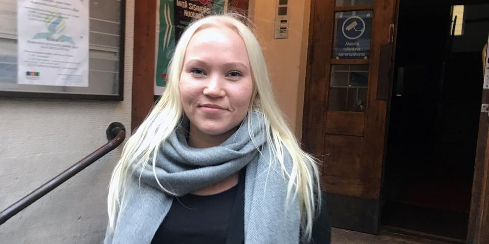 Silvia Leppälä, 23, standing at the entrance of Helsinki Seventh-day Adventist Church in Helsinki, Finland. (Andrew McChesney / Adventist Mission)