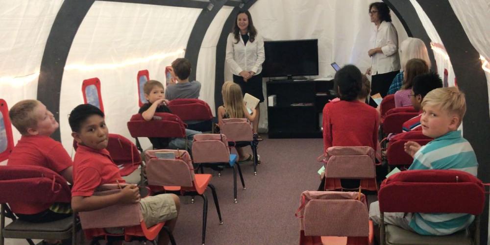 Children preparing for takeoff on Missionary Airlines at the Grandview Seventh-day Adventist Church in the U.S. state of Texas. (Andrew McChesney / Adventist Mission)