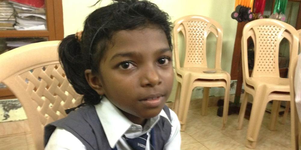 Parisudha, who like many people in India uses only one name, speaking about her love for Jesus and her grandfather in the principal's office at  James Memorial Higher Secondary School in Prakasapuram, India. (Andrew McChesney / Adventist Mission)