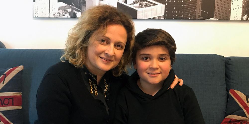 Manuel Iacono, 9, with his mother, Eliana Di Marco, in their home in Ragusa on the Italian island of Sicily. (Andrew McChesney / Adventist Mission)