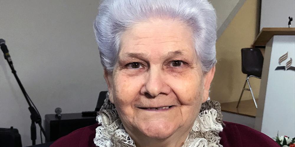 Salvatrice “Salvina” Mazza, 85, standing in the old Seventh-day Adventist church in Ragusa, Italy. Through a Thirteenth Sabbath Offering, the church was moving from the rented hall to its own building. (Andrew McChesney / Adventist Mission)