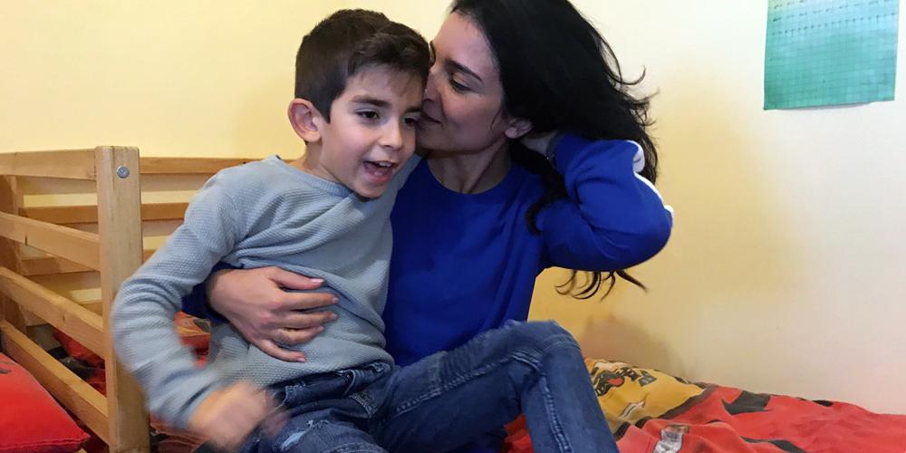 Thomas Boldrini, 7, with his mother, Alessandra Covato, in their home in Ragusa on the Italian island of Sicily. (Andrew McChesney / Adventist Mission)
