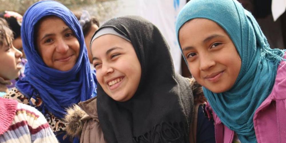 Syrian refugee girls from the Adventist Learning Center mingling with other refugee girls at a tent camp in northern Lebanon. The girl in the center is Sheyam, 12, from Aleppo and the one on the right is Fatmeh, 12, from Deir ez-Zor. (Photos: MENA)