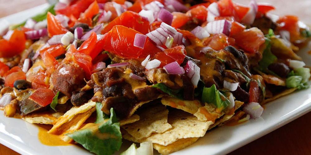 Among the items on the Olive Branch menu is the Haystack, described as “organic corn chips, chili, cheez sauce, lettuce, tomato, red onion, served with salsa, guacamole, and house spread.” (lewistonark.com)