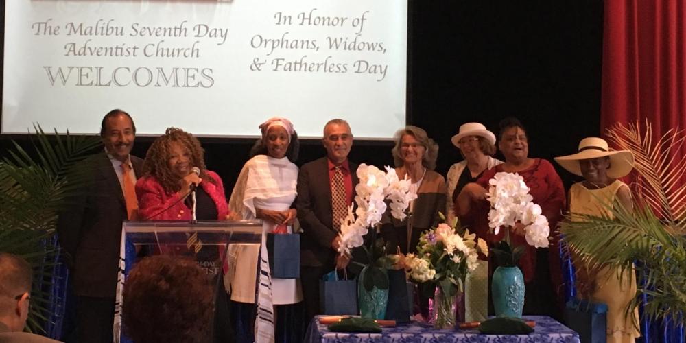 Judith Miranda, second left, welcoming guests to the Malibu Seventh-day Adventist Church in California on April 15, 2017. Child welfare workers, citing privacy concerns, asked that no photos be released of the foster children. (Photo courtesy of Judith Miranda)