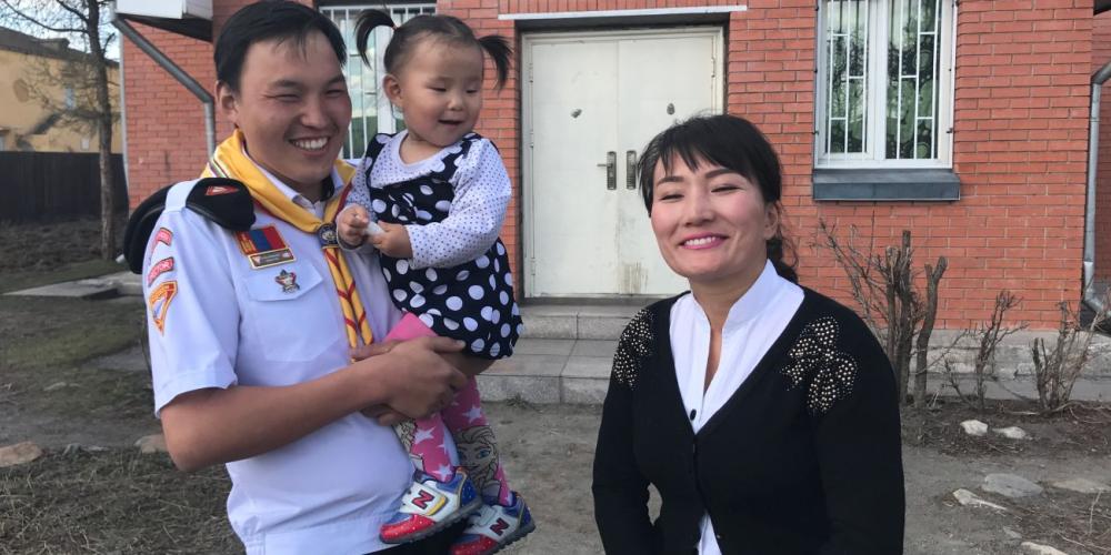 Bolorgegee “Gege” Saran with his wife and daughter outside the Adventist church in Bulgan, an isolated town located a seven-hour drive from Mongolia’s capital. (Andrew McChesney / Adventist Mission)