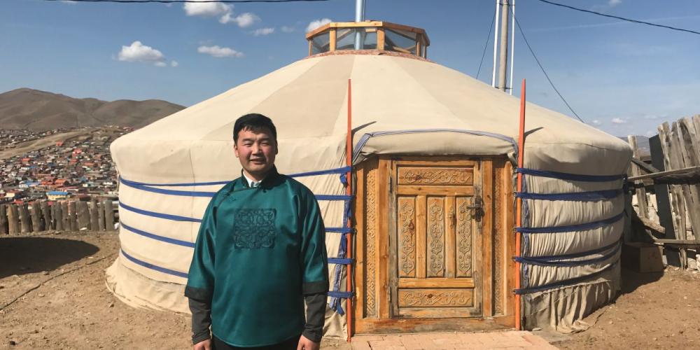 Bumchin Erdenebat standing beside his yurt, which doubles at Mongolia's only Pathfinder church, in Ulaanbaatar on May 6, 2017. (Andrew McChesney / Adventist Mission)