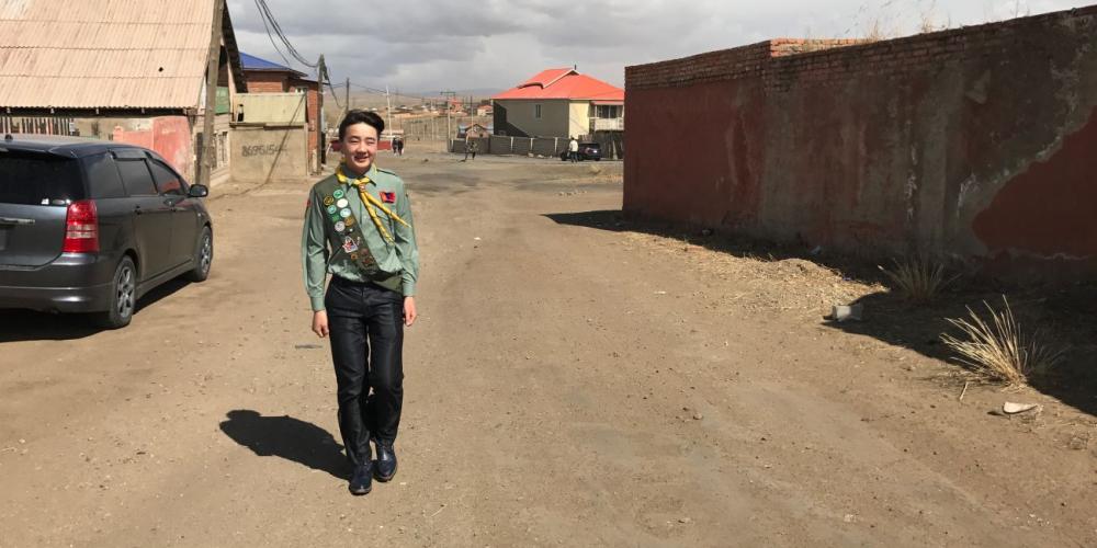 Dulguun Galsan walking down a street similar to the one where three strangers first told him about the Adventist church in Nalliah, Mongolia. (Photos: Andrew McChesney / Adventist Mission)