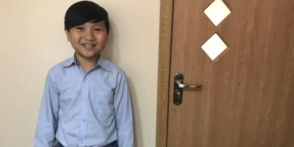 “After God answered my prayers, I believed that He is real,” says Iveel Namjildorj, pictured at the Tuscal School in Ulaanbaatar, Mongolia. (Andrew McChesney / Adventist Mission)