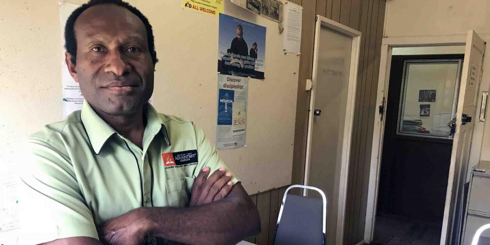 James Kiangua, 40, standing in his office at the Adventist Church’s Eastern Highlands Simbu Mission in Goroka, Papua New Guinea. (Andrew McChesney / Adventist Mission)