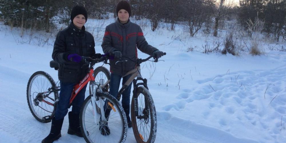 Nikita, 12, left, and Daniil, 13, standing with their bicycles, which were answers to prayer, outside their home in Klemyonovo, Russia, in January 2018. (Photos courtesy of the Balan family)