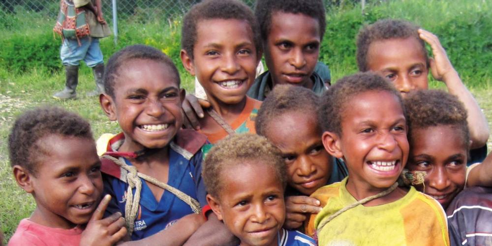 A group of children in Papua New Guinea, where 18 children’s discipleship centers will be built. (Adventist Record)