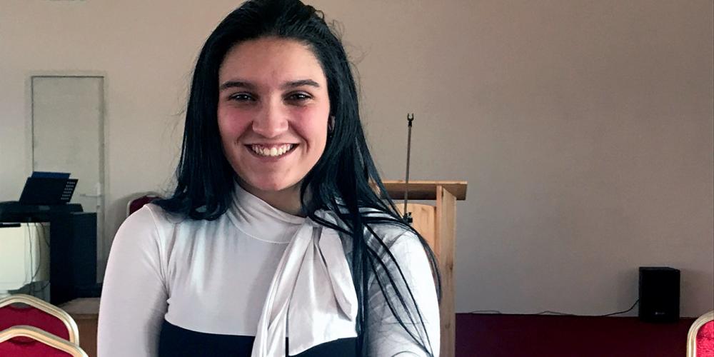 Dominika Gaborova, 15, standing in the Seventh-day Adventist church in Rakúsy, a Roma settlement of 2,000 people in Slovakia. (Andrew McChesney / Adventist Mission)