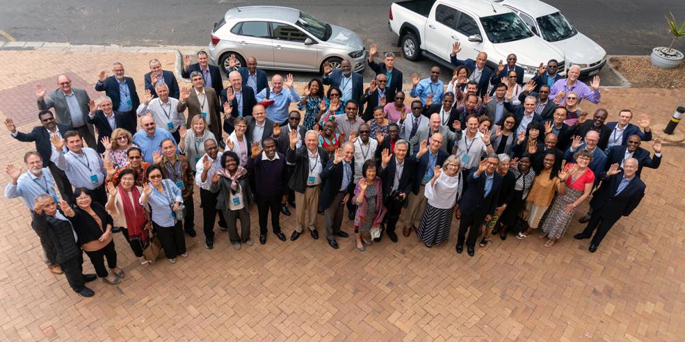 Seventh-day Adventist world church leaders and their spouses waving for a group photo at the 13th Global Leadership Summit in Cape Town, South Africa, on Feb. 5, 2020. (Otieno Mkandawire / SID)