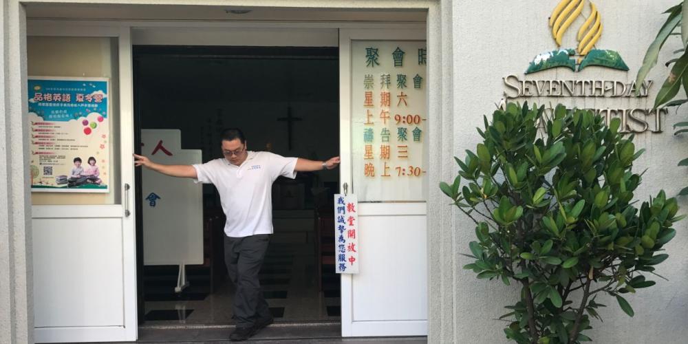 Pastor Jack Chen opening the front doors of his church in southwestern Taiwan. (Photos: Andrew McChesney / Adventist Mission)