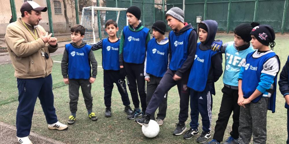 Bakhriddin Sanginov, left, coaching a soccer team of 11- to 13-year-old Muslim boys in Dushanbe, Tajikistan. (Andrew McChesney / Adventist Mission)