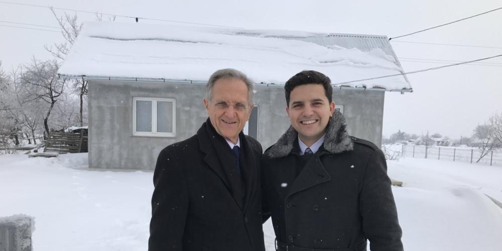 Pastors Wally Amundson,left, and Eduart Tilihoi visiting families in a community in northeastern Romania before evangelistic meetings in February 2017. (Photos courtesy of Wally Amundson)
