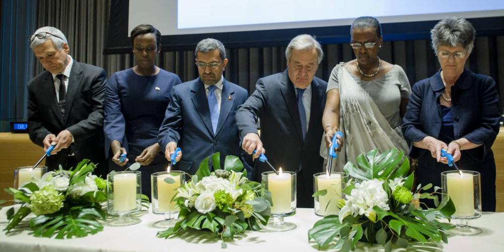 Carl Wilkens, left, joining the UN secretary-general, third right, and others in lighting candles at the opening of the annual commemoration of the International Day of Reflection on the genocide in Rwanda on April 7, 2017 at the United Nations in New York. (UN Photo / Manuel Elias)