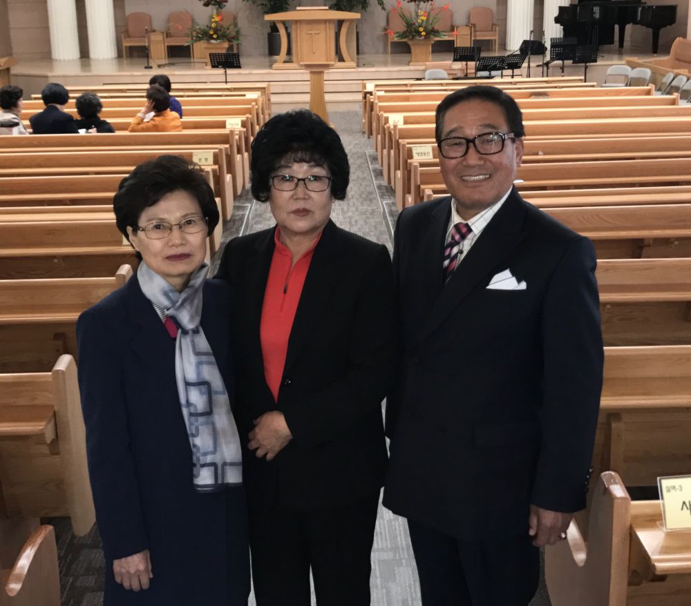 Ki-Jo Moon, right, posing with his wife, Soon-Ae Byun, center, and literature evangelist Hee-Sook Kim at the Byeollae Seventh-day Adventist Church in Seoul, South Korea, on April 22, 2017. (Andrew McChesney / Adventist Mission)