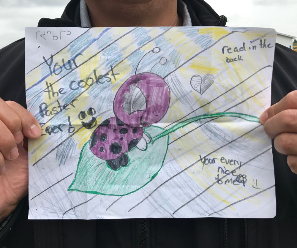 Today, Jojo’s hand-drawn picture hangs in Daniel’s office. It’s the first picture that he ever received from a student at the school.