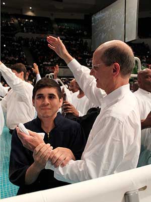 Tomas Olivera of Peekskill, New York, was the first of several new Seventh-day Adventists to be baptized today by Adventist Church president, Pastor Ted N. C. Wilson, at the NY13 event at the Nassau Veterans Memorial Coliseum in Uniondale, New York. [photos by Mark A. Kellner/Adventist Review]