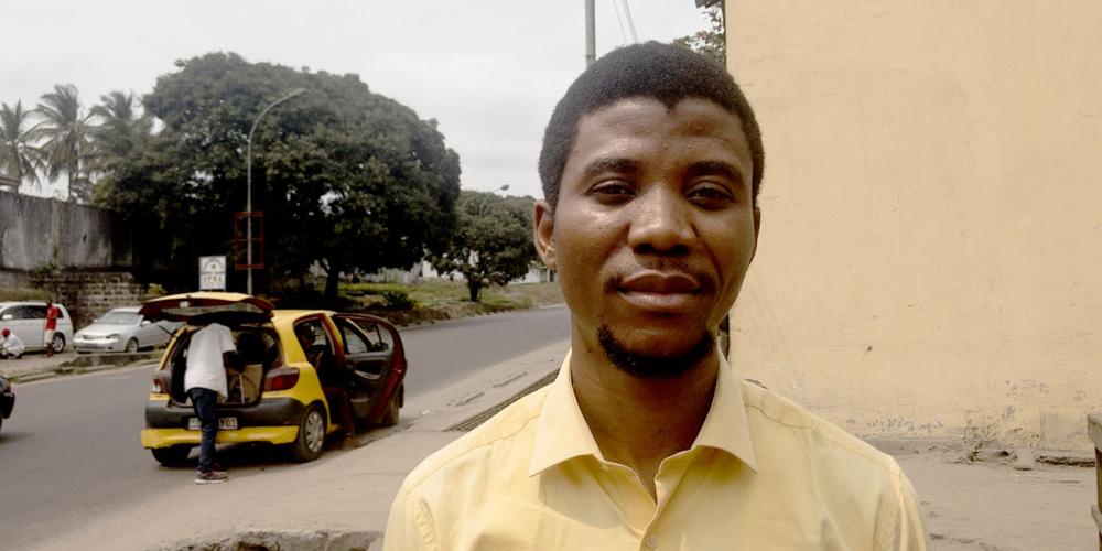 Business owner Patrick Kayend Omughamay, 32, standing on a street in Kinshasa, Democratic Republic of Congo. (Andrew McChesney / Adventist Mission)